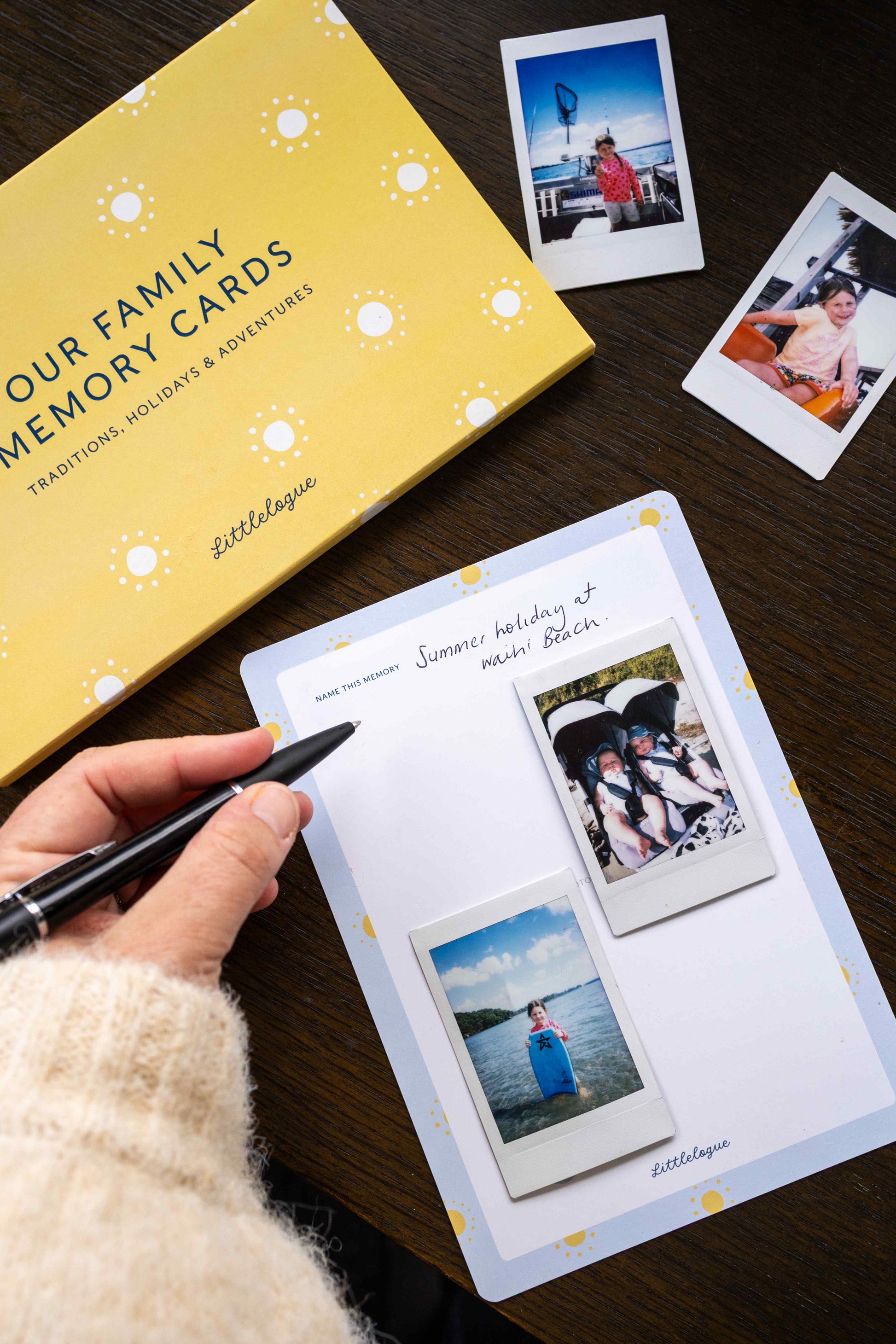 Family memory cards with photos on a wooden surface